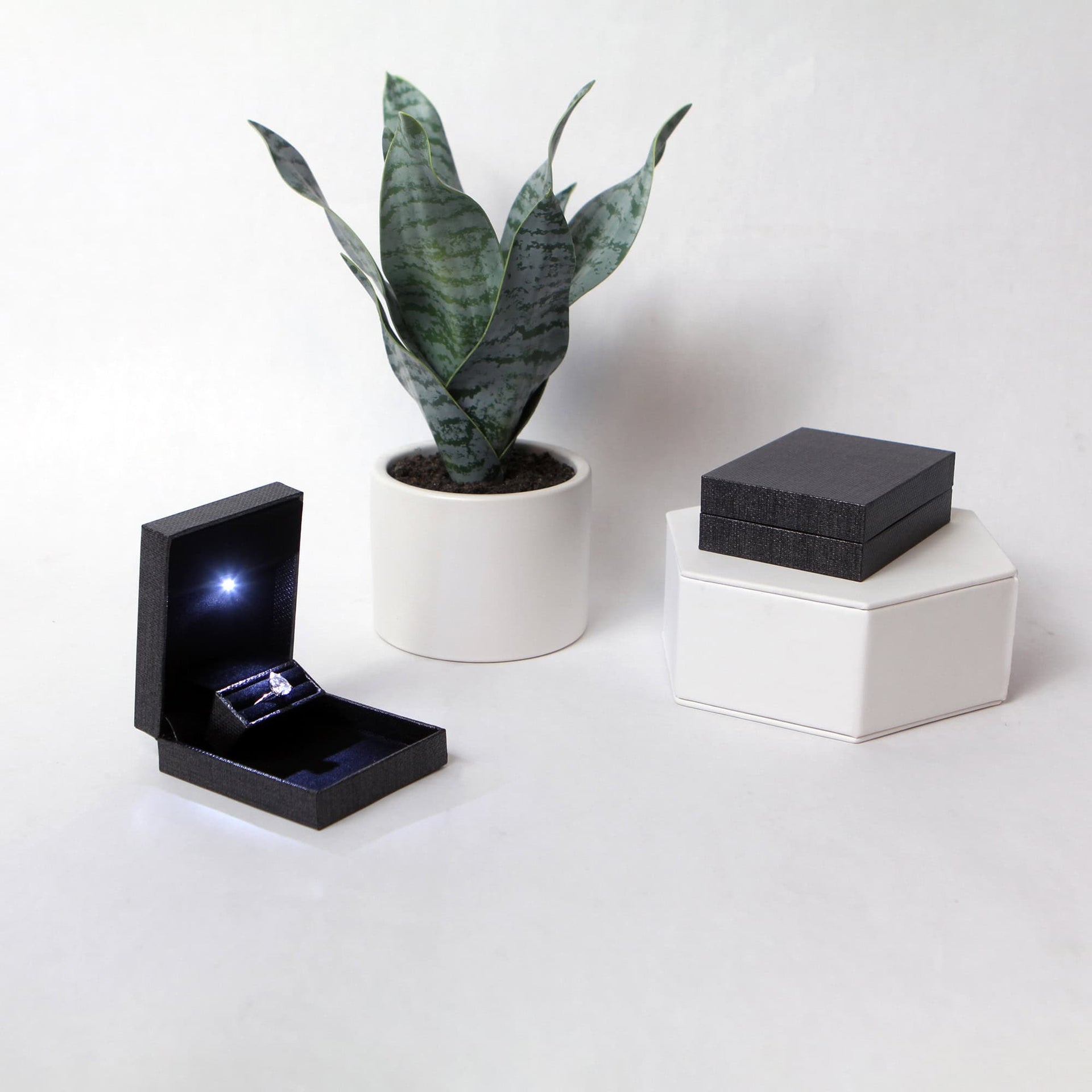 two grey metallic proposal ring box with light for diamond engagement ring