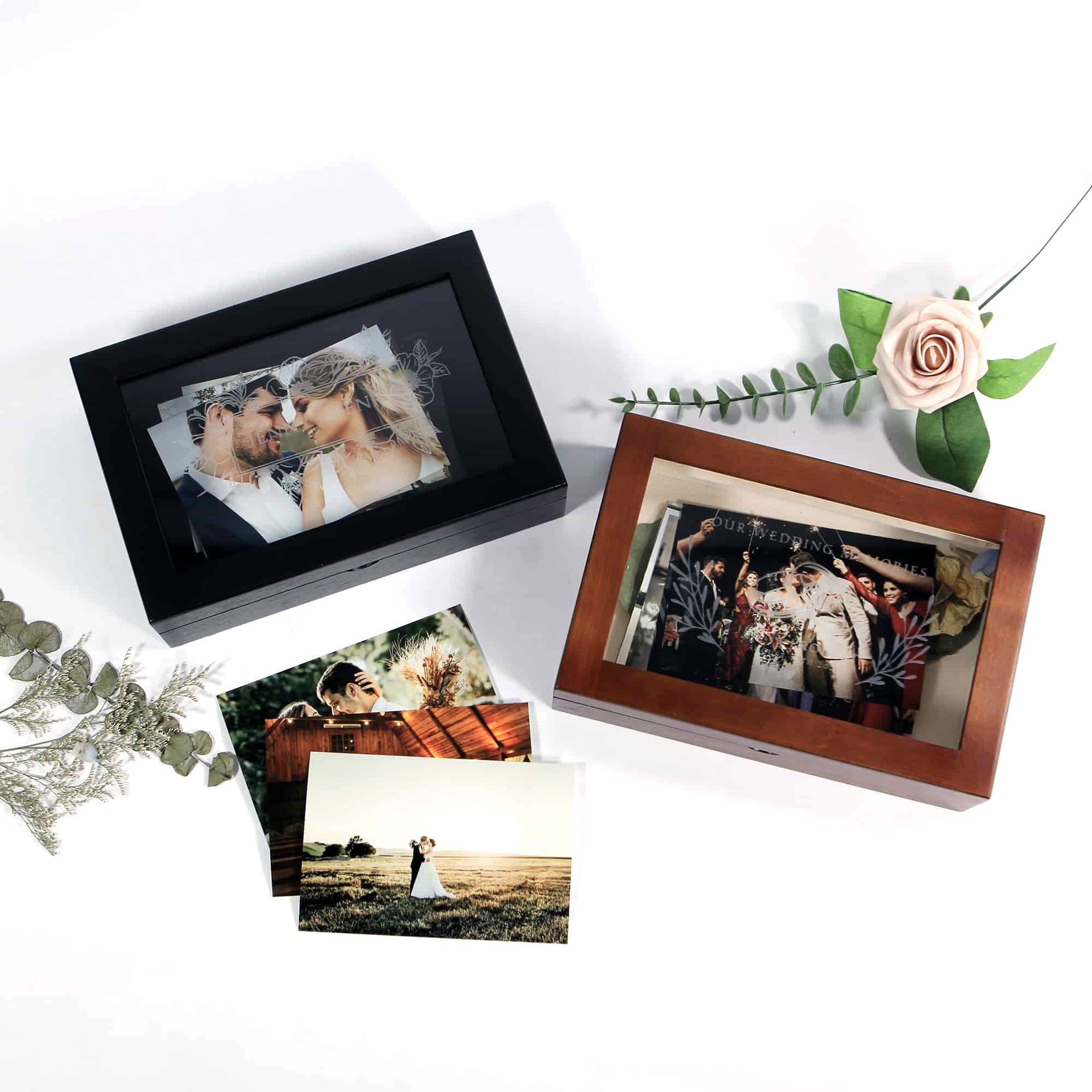 two wedding keepsake storage boxes with flower and photographs