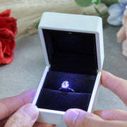 white proposal ring box with light