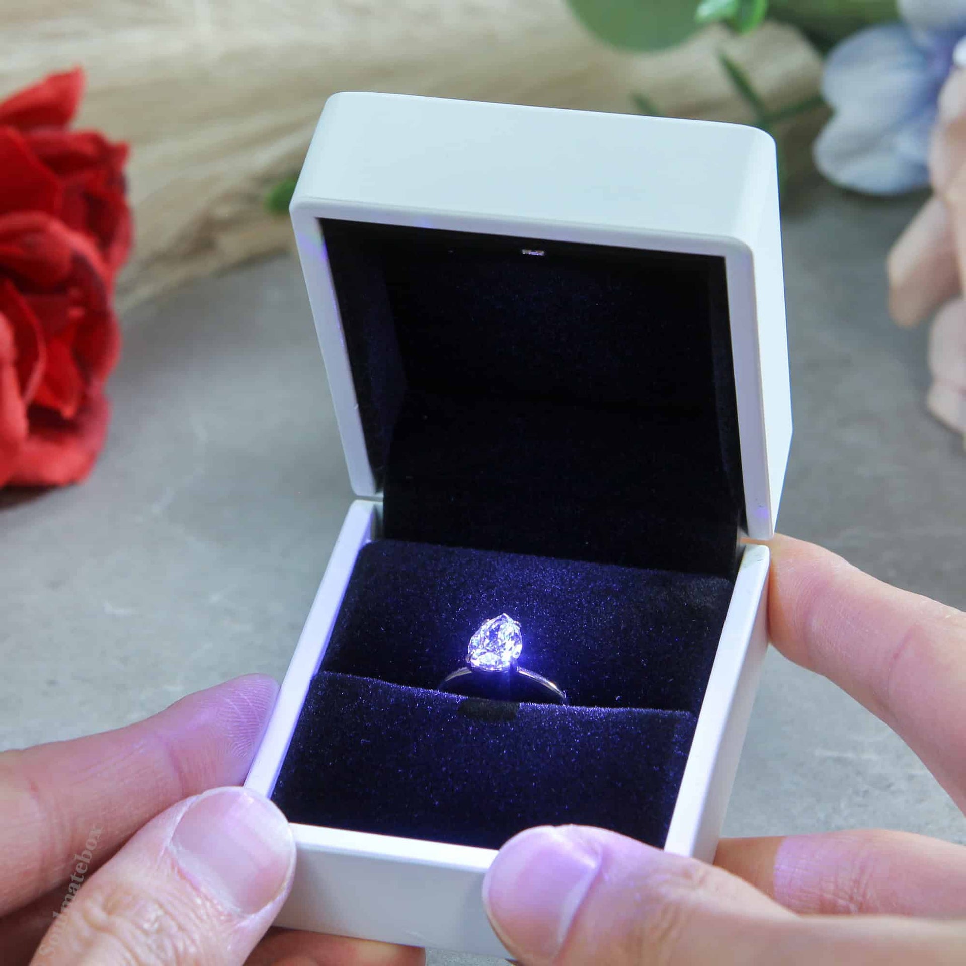 white proposal ring box with light