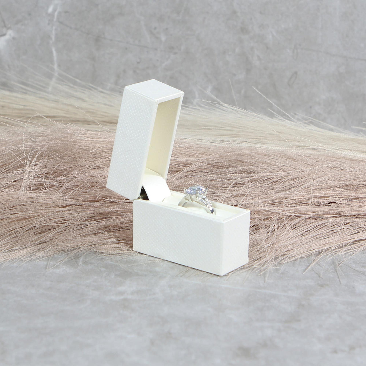 small white proposal ring box for engagement to her
