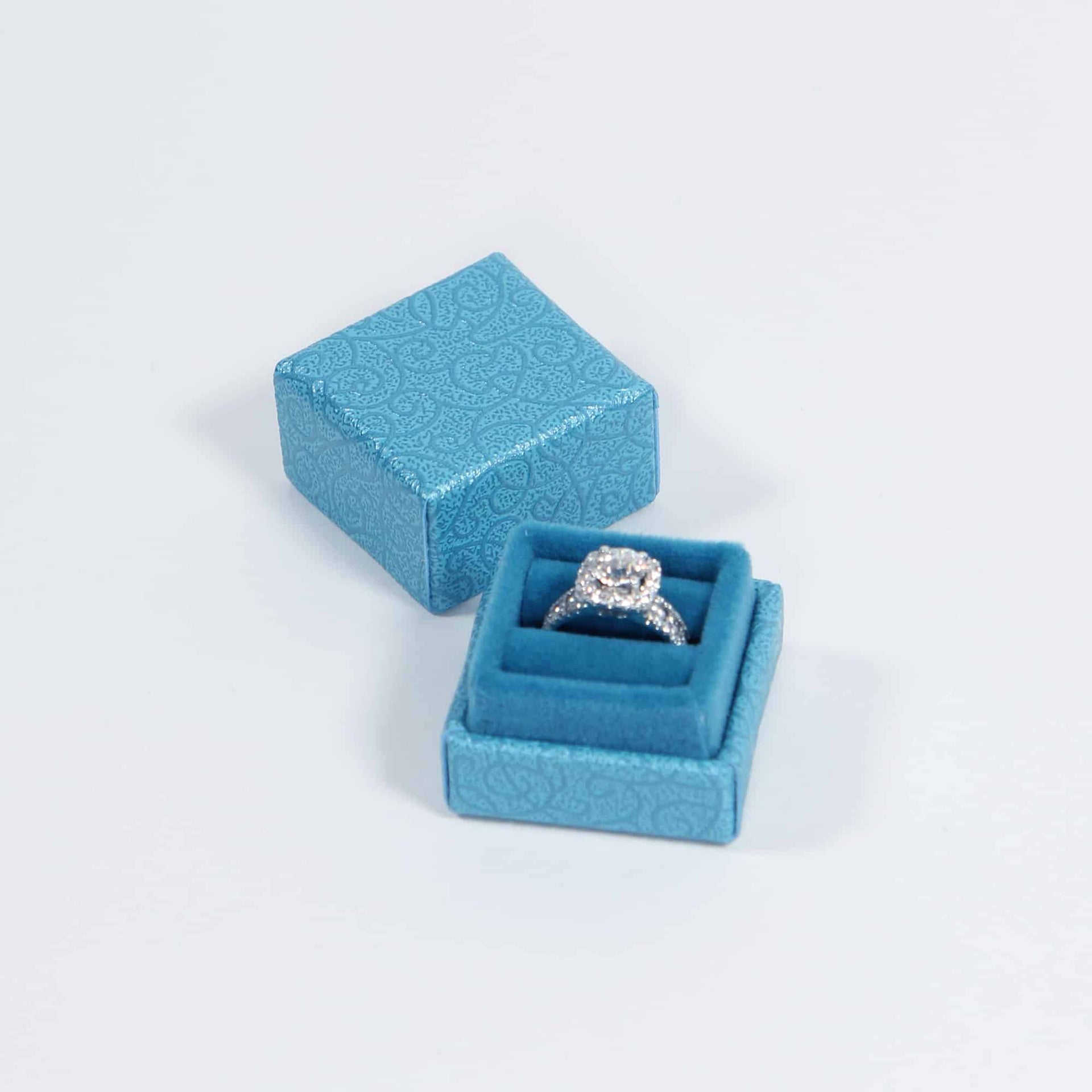 blue ring box with velvet interior 