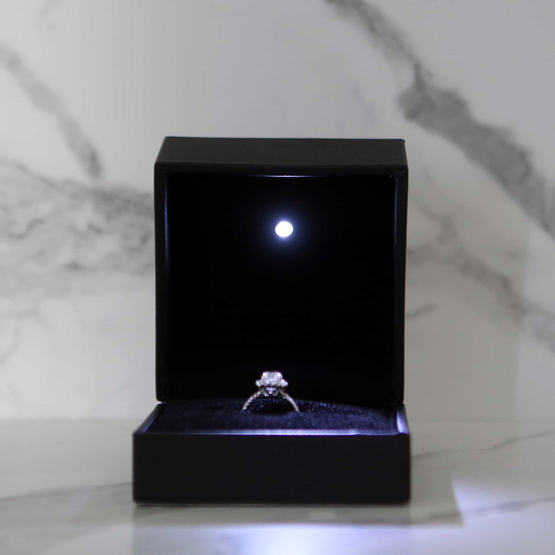 This is a large black led ring box that has a built in led light pointed down at the ring. Great for weddings, proposals, ,engagements or just to show off your gems! Proposal ring box with light, red ring box, engagement ring box with LED