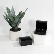 shiny gloss black ring box with wedding bands
