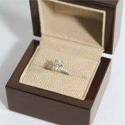 Diamond engagement ring in a wooden proposal ring box close up photo