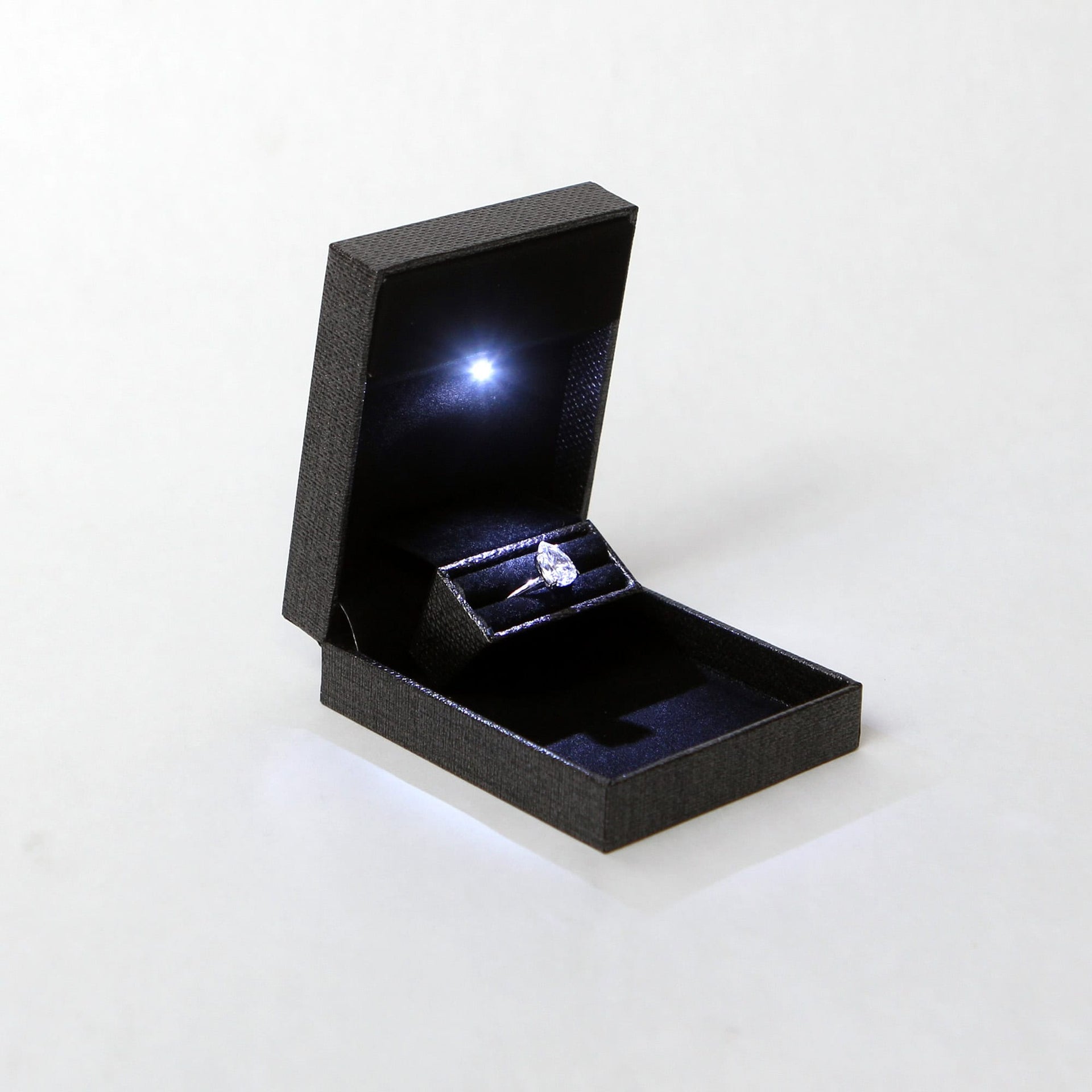 slim pocket sized grey ring box with led light for proposal and engagement