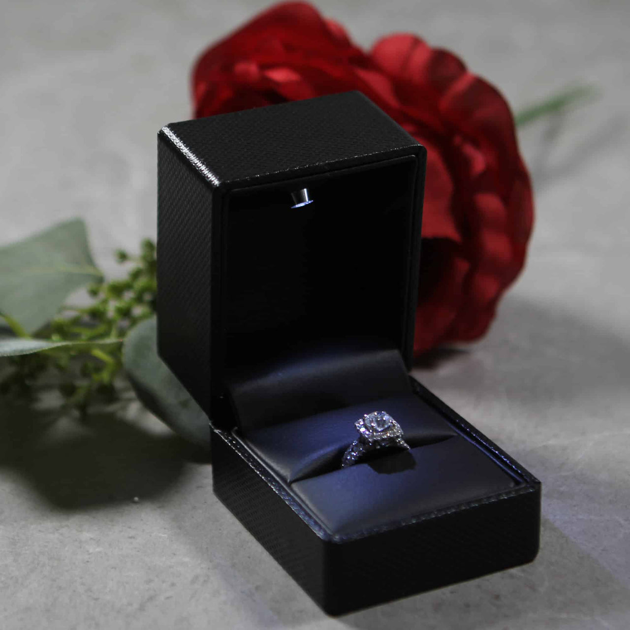 This is a modern black  ring box that has a built in led light pointed down at the ring. Great for weddings, proposals, ,engagements or just to show off your gems!