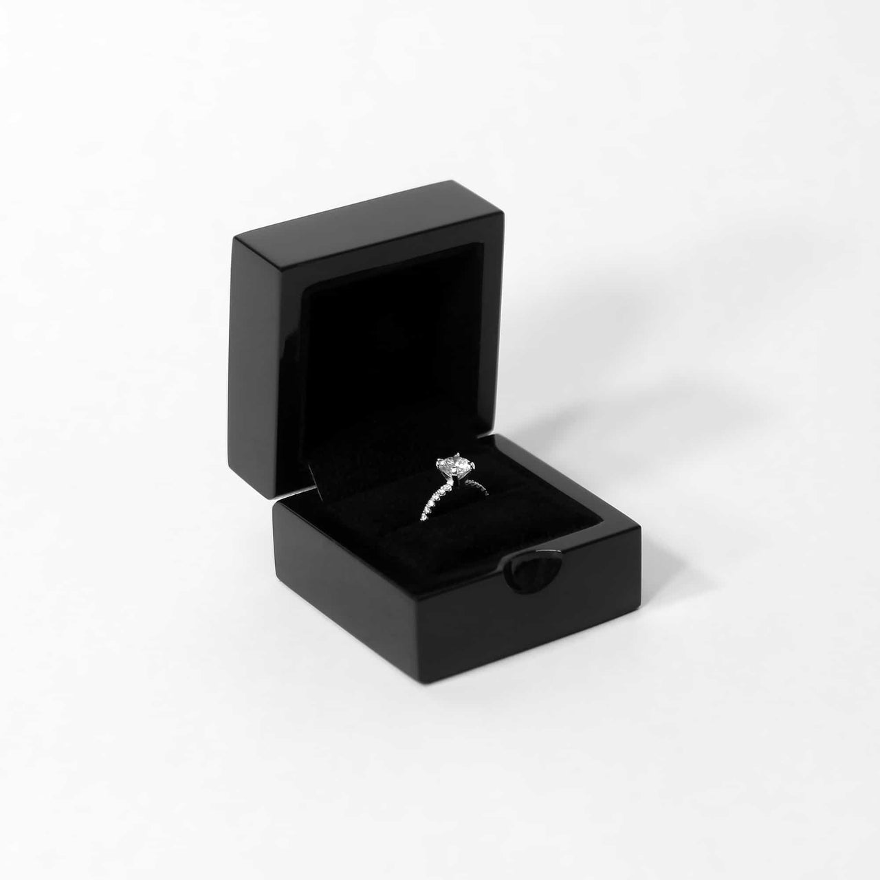 gloss black engagement ring box for her on a white background