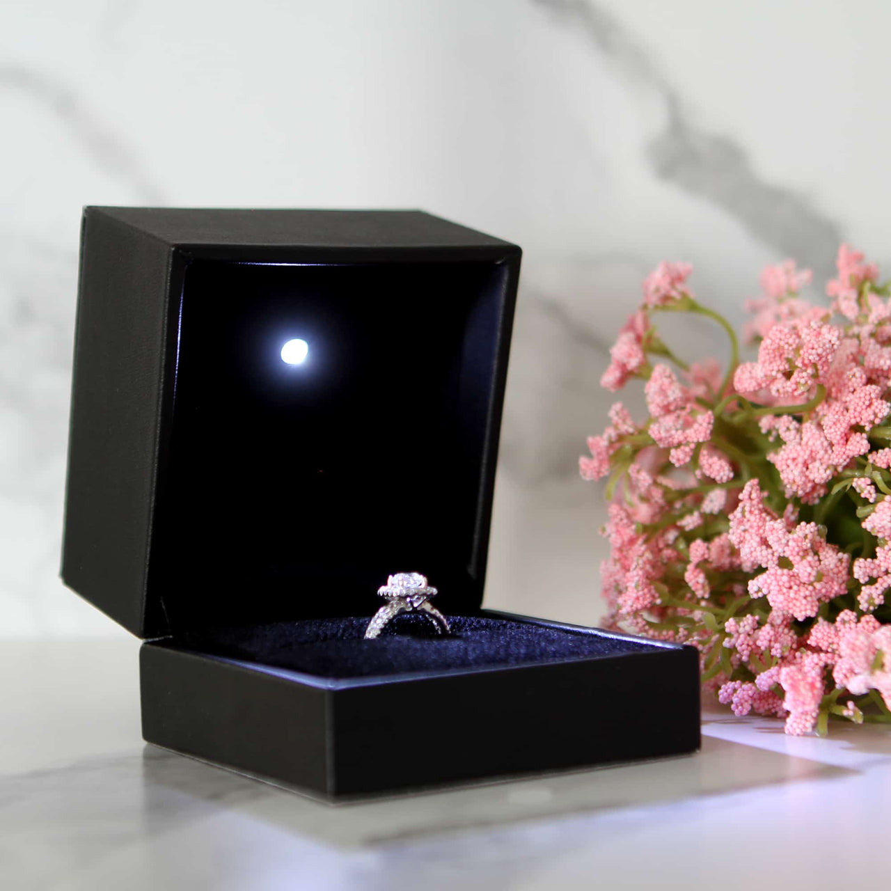 This is a large black led ring box that has a built in led light pointed down at the ring. Great for weddings, proposals, ,engagements or just to show off your gems! Proposal ring box with light, red ring box, engagement ring box with LED