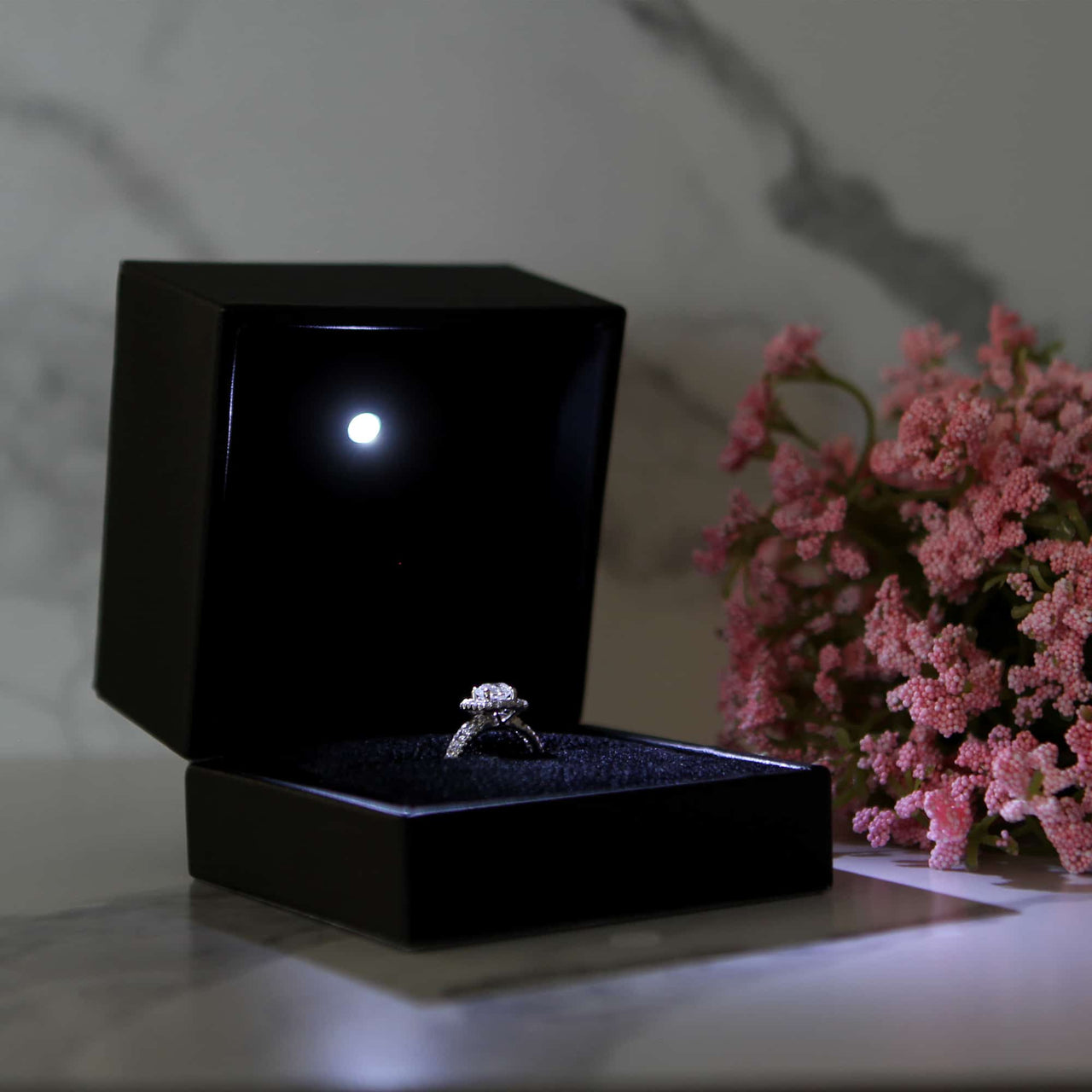 This is a large black led ring box that has a built in led light pointed down at the ring. Great for weddings, proposals, ,engagements or just to show off your gems! Proposal ring box with light, red ring box, engagement ring box with LED
