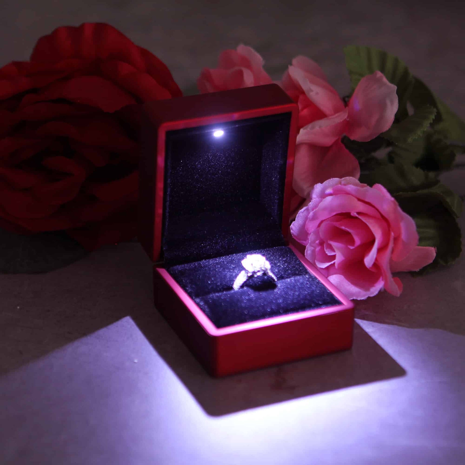This is a red  ring box that has a built in led light pointed down at the ring. Great for weddings, proposals, ,engagements or just to show off your gems! Proposal ring box with light, red ring box, engagement ring box with LED, light up ring box for proposals