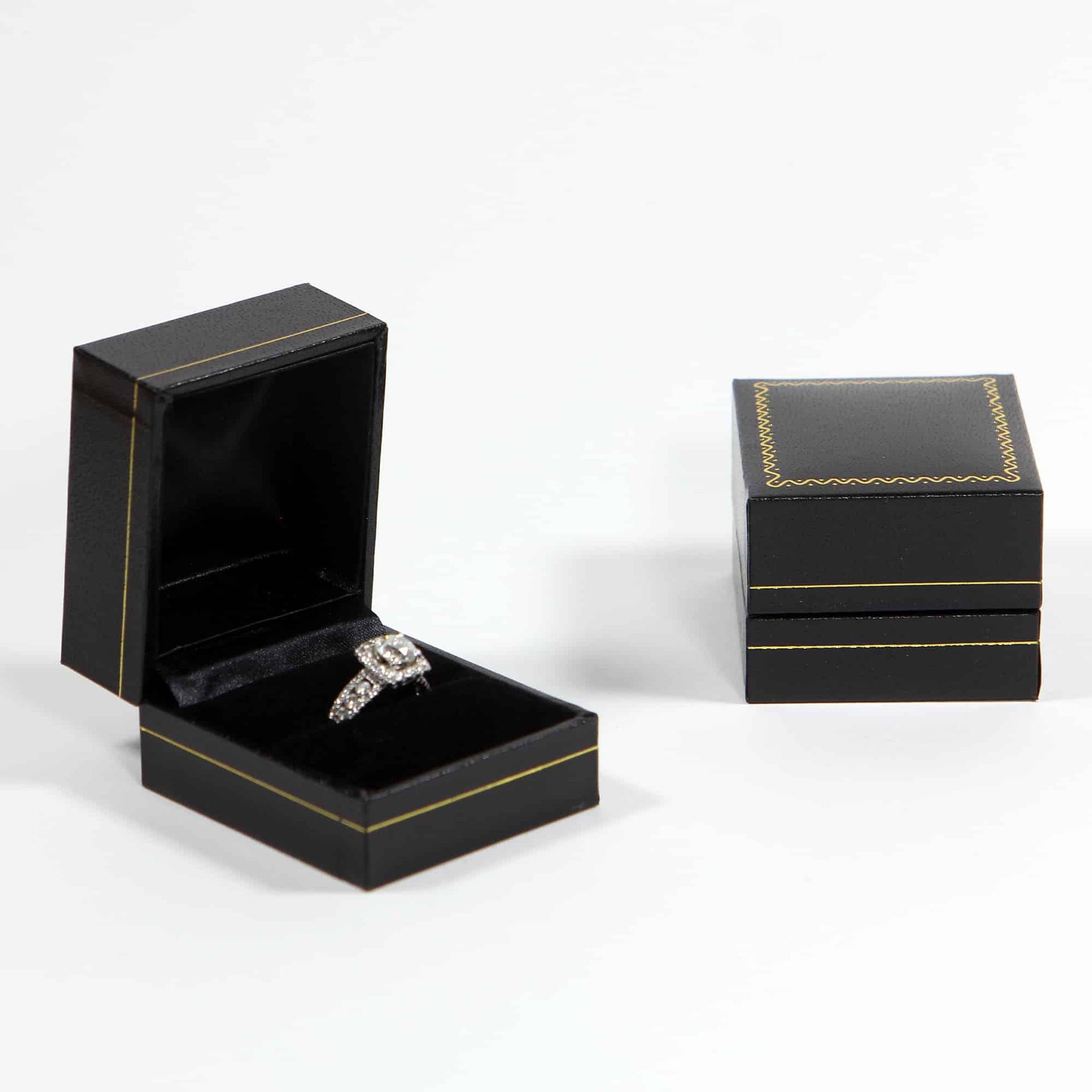 Show off your engagement with a black single ring box with gold laced design on top